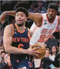  ?? MARY ALTAFFER/AP ?? New York Knicks guard Quentin Grimes (left) drives past Miami Heat forward Jimmy Butler in the second half of a game on March 29 at Madison Square Garden in New York.