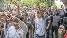  ?? IRANIAN LABOR NEWS AGENCY, VIA ASSOCIATED PRESS ?? Iran’s economic struggles led protesters to swarm into Tehran’s Grand Bazaar in June.