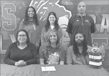  ?? Scott Herpst ?? Jessica Gray and J.J. Sutton were among the those in attendance to watch LFO senior Zoey Gray-Martin sign on to continue her basketball career at Calhoun Community College in Alabama. Also present for the ceremony were Lady Warriors’ assistant coaches Krista Davis and Jasmin Carey, along with head coach Dewayne Watkins.