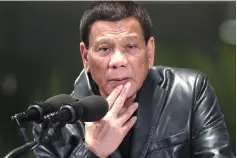  ??  ?? Duterte gesturing as he gives his departure speech at the Manila Internatio­nal airport. — AFP photo