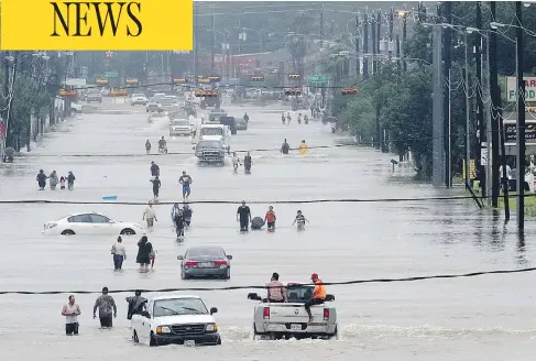  ?? THOMAS B. SHEA / AFP / GETTY IMAGES ?? Telephone Road in Houston on Sunday. While the governor of Texas thought there should be evacuation­s ahead of Hurricane Harvey, the mayor of Houston and officials in Harris County disagreed, urging residents to hunker down and ride out the storm.