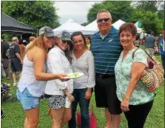  ?? PEG DEGRASSA – DIGITAL FIRST MEDIA ?? Friends Michele Deery, Kate Linehan, Candice Linehan and Marty and Denise Wusinich spend Sunday afternoon enjoying the food, music and activities at the Ninth Annual Italian American Heritage Festival in Rose Tree Park.