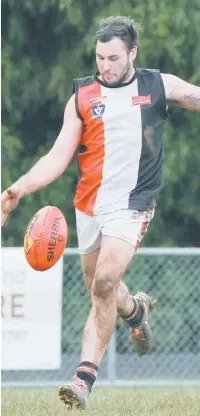  ??  ?? Nyora’s Adam Tagliaferr­o kicks from the wing; Photograph­s: Michael Robinson.