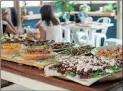  ??  ?? FOOD ENVY: The magnificen­t harvest table laid out for lunch at the Delish Sisters in Salt Rock.