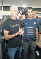  ?? Picture:SCOTT BARBOUR/GETTY IMAGES ?? FLIGHT TO FREEDOM: Refugee Bahraini footballer Hakeem al-Araibi walks with former Australian football captain and commentato­r Craig Foster as he arrives at the Melbourne Airport on Tuesday
