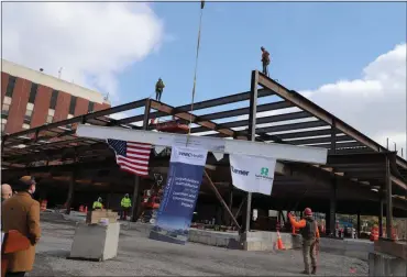  ?? PROVIDED ?? The beam is hoisted during the ‘topping-off’ ceremony on Thursday, March 4, at the Mary’s Avenue Campus of HealthAlli­ance Hospital in Kingston, N.Y.