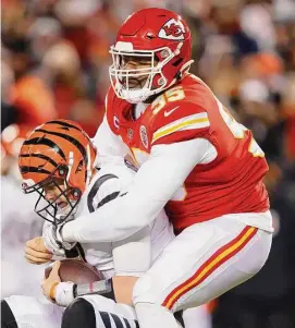  ?? David Eulitt/Getty Images ?? The Kansas City Chiefs’ Chris Jones sacks Joe Burrow of the Cincinnati Bengals during the first quarter in the AFC Championsh­ip Game at GEHA Field at Arrowhead Stadium on Jan. 29 in Kansas City, Mo.