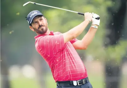  ?? Picture: Gallo Images ?? SMOOTH SWING. Thomas Aiken watches his approach shot during the second round of the Tshwane Open at Pretoria Country Club yesterday.