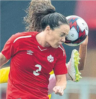  ?? ADRIAN WYLD THE CANADIAN PRESS ?? Canadian defender Allysha Chapman pays a price for heading the ball out of harm’s way in Sunday’s internatio­nal soccer clash with the Brazilians in Ottawa. The hosts were 1-0 winners. They’ll square off again Tuesday.