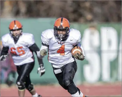  ?? JOHN BLAINE — FOR THE TRENTONIAN ?? Hamilton’s Kevin Boswell runs with the ball against Steinert during last year’s Thanksgivi­ng day game. Boswell is one of the top returning backs in the county.