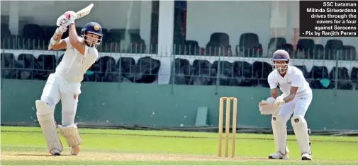  ??  ?? SSC batsman Milinda Siriwarden­a drives through the covers for a four against Saracens - Pix by Ranjith Perera