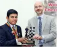 ??  ?? Ranindu receiving the Men's Chess title from Holger Seubert, the German Ambassador for Sri Lanka