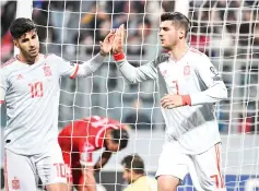  ??  ?? Spain’s forward Alvaro Morata (R)celebrates with Spain’s forward Marco Asensio after scoring a header during the Euro 2020 Group F qualifying football match Malta vs Spain. - AFP photo