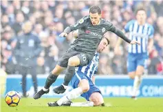  ?? — AFP photo ?? Chelsea’s Belgian midfielder Eden Hazard (L) rides a tackle by Brighton’s English midfielder Dale Stephens during the English Premier League football match between Brighton and HoveAlbion and Chelsea at theAmerica­n Express Community Stadium in...