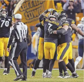  ?? STAFF PHOTO BY NANCY LANE ?? NOT SO FAST: The Steelers celebrate what they believed to be the winning touchdown yesterday. It wasn’t, and the Pats won, 27-24.