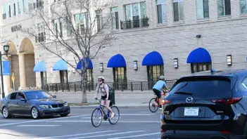  ?? RJ Sangosti, The Denver Post ?? “The new law doesn’t change the rules of the right of way whatsoever,” said Jack Todd, director of communicat­ions and policy at the advocacy group Bicycle Colorado.