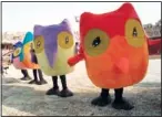  ?? (File Photo/AP/Eric Draper) ?? Snowlets, the Olympic mascots, walk around the stadium Feb. 7, 1998, prior to the opening ceremony of the Winter Olympics at Minami Nagano Sports Park in Nagano, Japan.