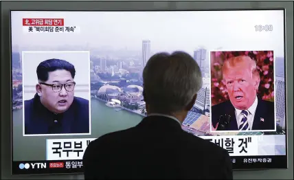  ?? AP PHOTO ?? A man watches a TV screen showing file footage of U.S. President Donald Trump and North Korean leader Kim Jong Un during a news program at the Seoul Railway Station.
