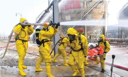  ?? Region. Photograph: Xinhua/Rex/Shuttersto­ck ?? Firefighte­rs take part in an emergency drill against winter chemical hazards and accidents in China's Inner Mongolia Autonomous