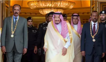  ??  ?? Saudi Arabia’s King Salman bin Abdulaziz Al Saud (centre), Ethiopia’s Prime Minister Abiy Ahmed (right) and Eritrean President Isaias Afwerki pose for the camera during the ceremony to sign a peace agreement in Jeddah, Saudi Arabia. — Reuters photo