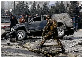  ?? AP 2016 ?? Afghan security personnel inspect the site of a 2016 roadside bomb blast in Kabul, Afghanista­n. A U.N. report on Thursday showed a rise in attacks deliberate­ly targeting civilians last year that accounted for 27 percent of civilian casualties.