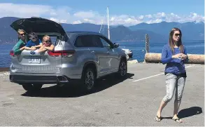  ?? SUPPLIED ?? Eco-travel blogger Jami Savage and family stop for a photo while taking the Toyota Highlander Hybrid out for a test-drive along the Sea to Sky Highway.