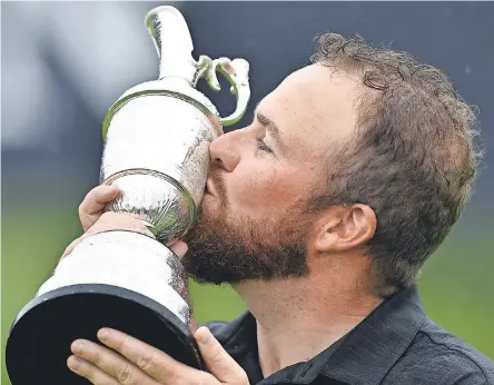  ?? IAN RUTHERFORD/USA TODAY SPORTS ?? Irishman Shane Lowry celebrates after earning his first major title by winning the British Open by six strokes Sunday at Royal Portrush Golf Club in Northern Ireland.