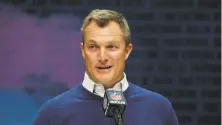  ?? Charlie Neibergall / Associated Press ?? Niners general manager John Lynch traded down and up in the first round to snag a defensive lineman and a wide receiver.
