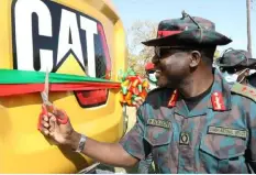  ?? ?? ZNS commander Lt-Gen. Maliti Solochi unveiling an excavator at the Lands Developmen­t Branch in Makeni, Lusaka recently. - Picture: ZNS.