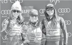  ??  ?? Mikaela Shiffrin of the United States, Tessa Worley (centre) of France with the crystal globe and Sofia Goggia of Italy during the women’s giant slalom alpine skiing race in the 2017 Audi FIS World Cup Finals at Aspen Mountain. — USA Today photo