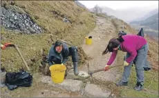  ??  ?? Trainee volunteer rangers at work on Ben Nevis.