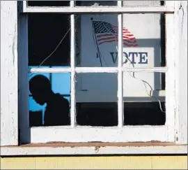  ?? Bob Chamberlin
Los Angeles Times ?? POLITICAL STRATEGIST­S said at least 15 measures have a shot at making it on the ballot next November. Above, an election worker helps at a voting station.