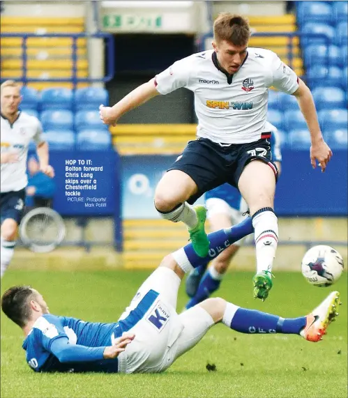  ?? PICTURE: ProSports/ Mark Pollitt ?? HOP TO IT: Bolton forward Chris Long skips over a Chesterfie­ld tackle