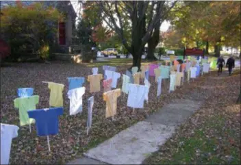  ?? KEVIN TUSTIN - DIGITAL FIRST MEDIA ?? The Memorial of the Lost setup by Heeding God’s Call at the Trinity Episcopal Church in Swarthmore. Each T-shirt has the name of a victim of gun violence in Delaware County.