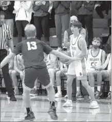  ??  ?? Top right: Eli Coble controls the ball for Broken Bow during their home game with Wood River on Jan. 15. He came off the bench in the second half of the game and gave the Indians some solid playing time.