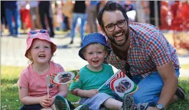  ?? Photos by Valerie O’Sullivan ?? ABOVE: Neasa O’Sullivan in rhythmwith­the music as she tries out the drums during the July 4 fun in Killarney last week.
RIGHT: Saffra and Henry McCarthy with their Dad, Adrian McCarthy, in independen­t, celebrator­y mood as they have a blast at the July...