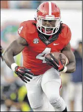  ?? SANDERLIN / BSANDERLIN@AJC.COM
BRANT ?? Running back Keith Marshall rushed just three times for 16 yards and had a 6-yard reception in the 27-3 loss to Florida.