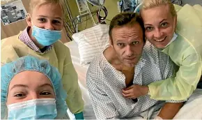  ?? AP ?? Alexei Navalny with his daughter Daria, son Zahar and wife Yulia in a Berlin hospital where the Russian opposition leader is recovering from poisoning.