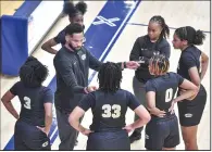  ?? (NWA Democrat-Gazette/Hank Layton) ?? Coach Marlon Williams (center) led the Little Rock Central girls basketball team to their first state championsh­ip this season. For his efforts, Williams is the 2023-24 Arkansas Democrat-Gazette’s All-Arkansas Preps girls coach of the year.