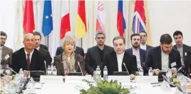  ?? EPA ?? Iranian deputy foreign minister Abbas Araghchi, fifth from right, said the coronaviru­s had hit the country harder than US sanctions