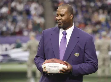  ?? ANDY KING - THE ASSOCIATED PRESS ?? In this Dec. 15, 2013, file photo, former Minnesota Viking Chris Doleman acknowledg­es the crowd during a ceremony honoring the All Mall of America Field team during halftime of a game between the Vikings and the Philadelph­ia Eagles in Minneapoli­s.