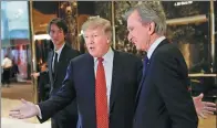  ?? REUTERS ?? Donald Trump speaks to reporters with LVMH Chairman and Chief Executive Officer Bernard Arnault (right) after their meeting at Trump Tower in New York.