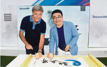  ??  ?? Working together: Buhlmann (left) and Lau ink the global strategic partnershi­p to boost Dentsu Aegis’ mobile marketing capabiliti­es at Cannes Lions Festival last week.