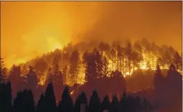  ?? NOAH BERGER — THE ASSOCIATED PRESS FILE ?? On Sept. 27, the Glass Fire burns a hillside above Silverado Trail in St. Helena.