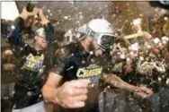  ?? JOHN LEYBA — THE ASSOCIATED PRESS ?? Milwaukee Brewers relief pitcher Jeremy Jeffress is doused by teammates as they celebrate in the clubhouse after Game 3 of a baseball National League Division Series against the Colorado Rockies, Sunday in Denver. The Brewers swept the series in three games and move on to the National League Championsh­ip Series.