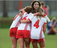  ??  ?? Emily O’Reilly gets three of her colleagues in a celebrator­y headlock after Tinahely claimed their four-in-a-row by beating St Pat’s.