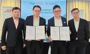  ?? ?? (From second left) dr Seow and Ngeow with the strategic partnershi­p documents at the signing ceremony.