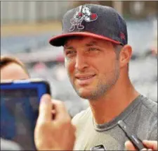  ?? KYLE FRANKO — TRENTONIAN PHOTO ?? Binghamton’s Tim Tebow answers questions from the media prior to batting practice at Arm & Hammer Park on Friday night.