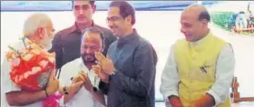  ?? PTI ?? Prime Minister Narendra Modi being greeted by Shiv Sena chief Udhav Thackeray as Home minister Rajnath Singh looks on at a meeting of NDA in New Delhi on Monday.