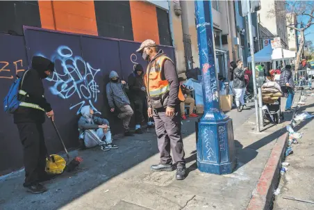  ?? Photos by Nick Otto / Special to The Chronicle ?? Security guard Ron Haysbert keeps an eye on Hyde Street and Golden Gate Avenue, a corner known for drug dealers and users.